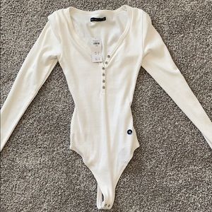 Brand new, tags still on, white bodysuit